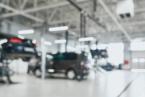 Blurred image of cars in a garage