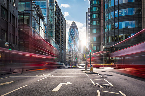 Vehicles in motion on a road in London