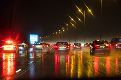 Cars driving on a motorway at night